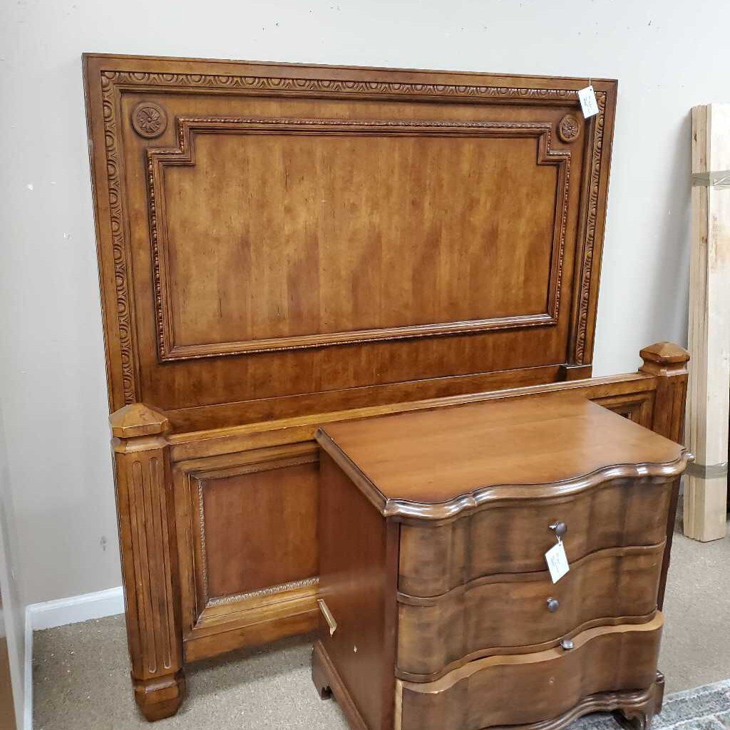 Bed with carved wood detail